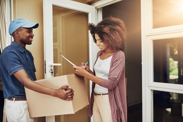 Customer receiving a doorstep delivery from a Dukago rider